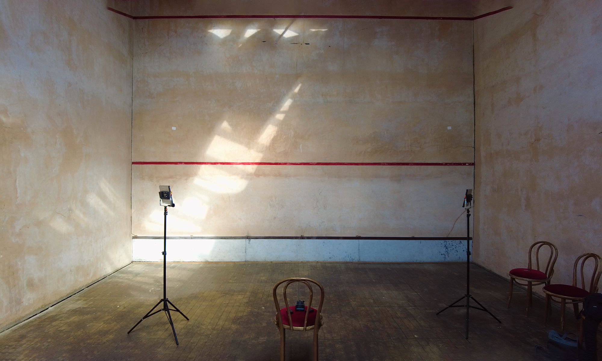 Image of an empty 18th Century squash court.